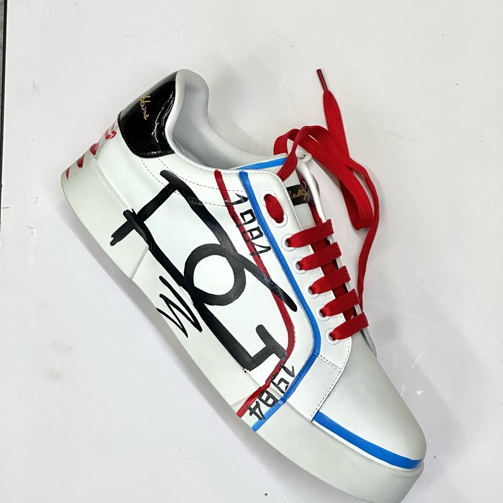 White and Red Athletic Sneakers with Bold Design